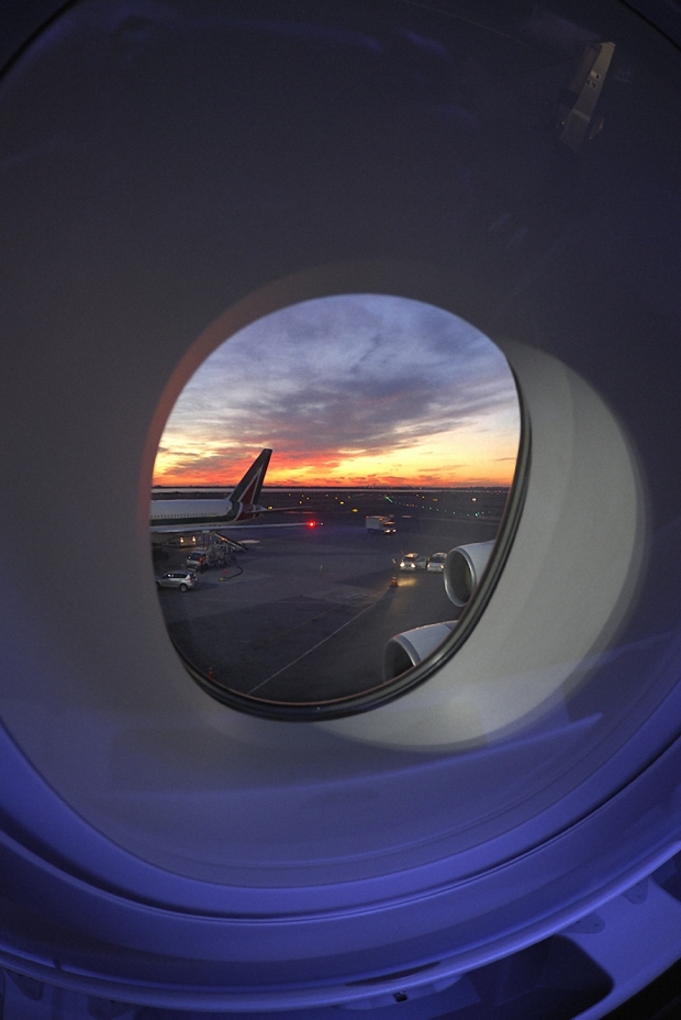plane-window-airport-sunset